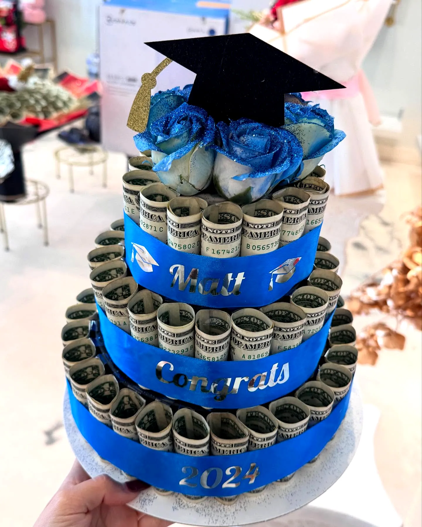 Trendy Graduation Money Cake Design with Bold Royal Blue and Creative Decor