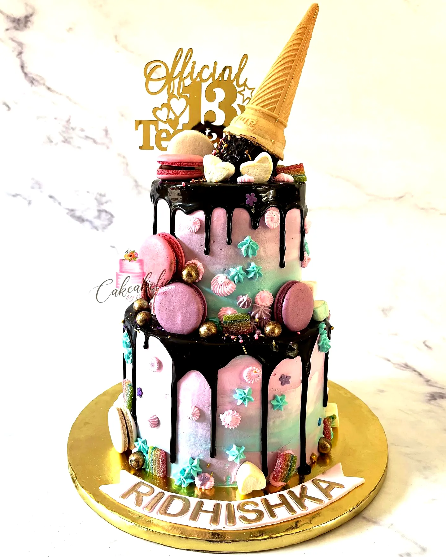 Whimsical 13th Birthday Cake Design in Pastel Pink and Blue