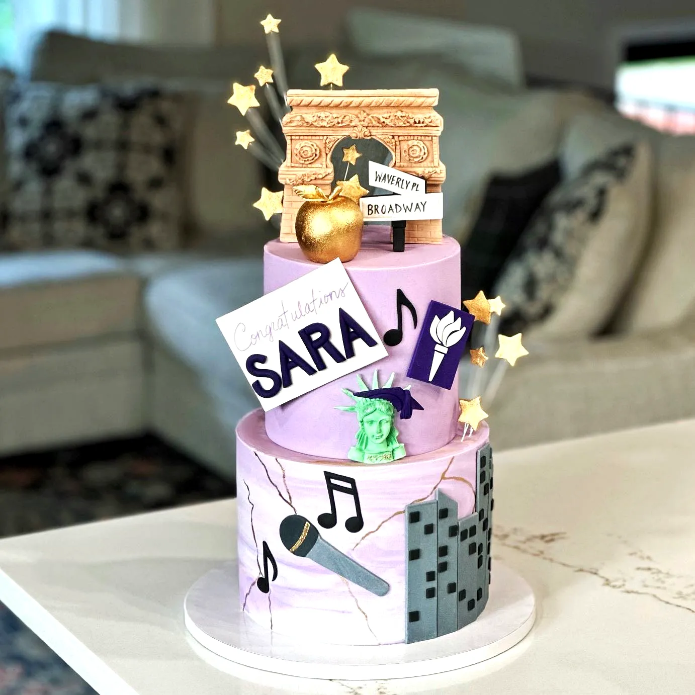 Whimsical 2 Tier Graduation Cake Design with Iconic New York Elements