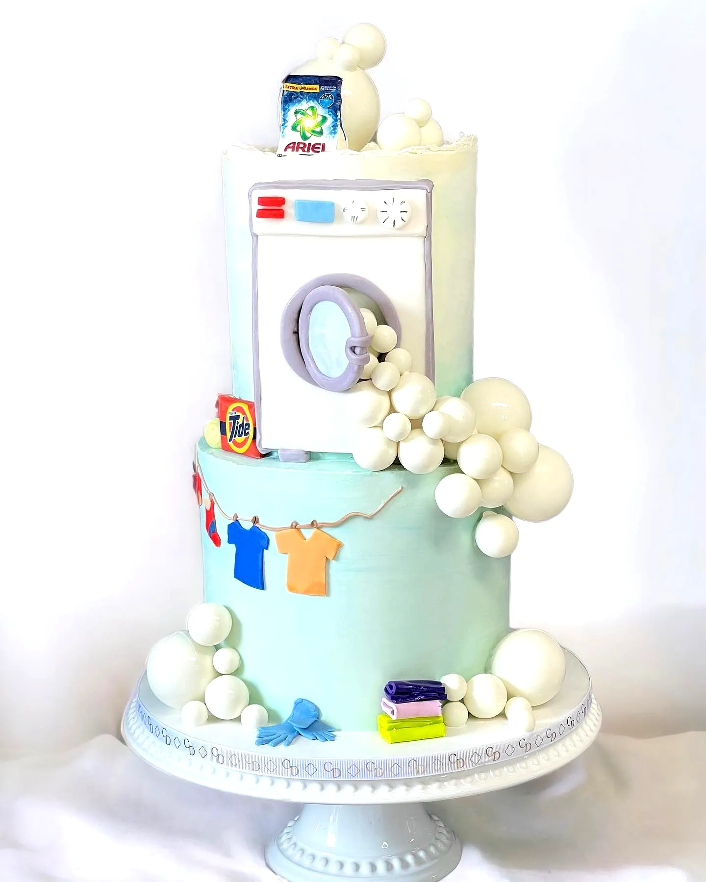 Whimsical Birthday Cake Design Featuring a Playful Laundry Scene