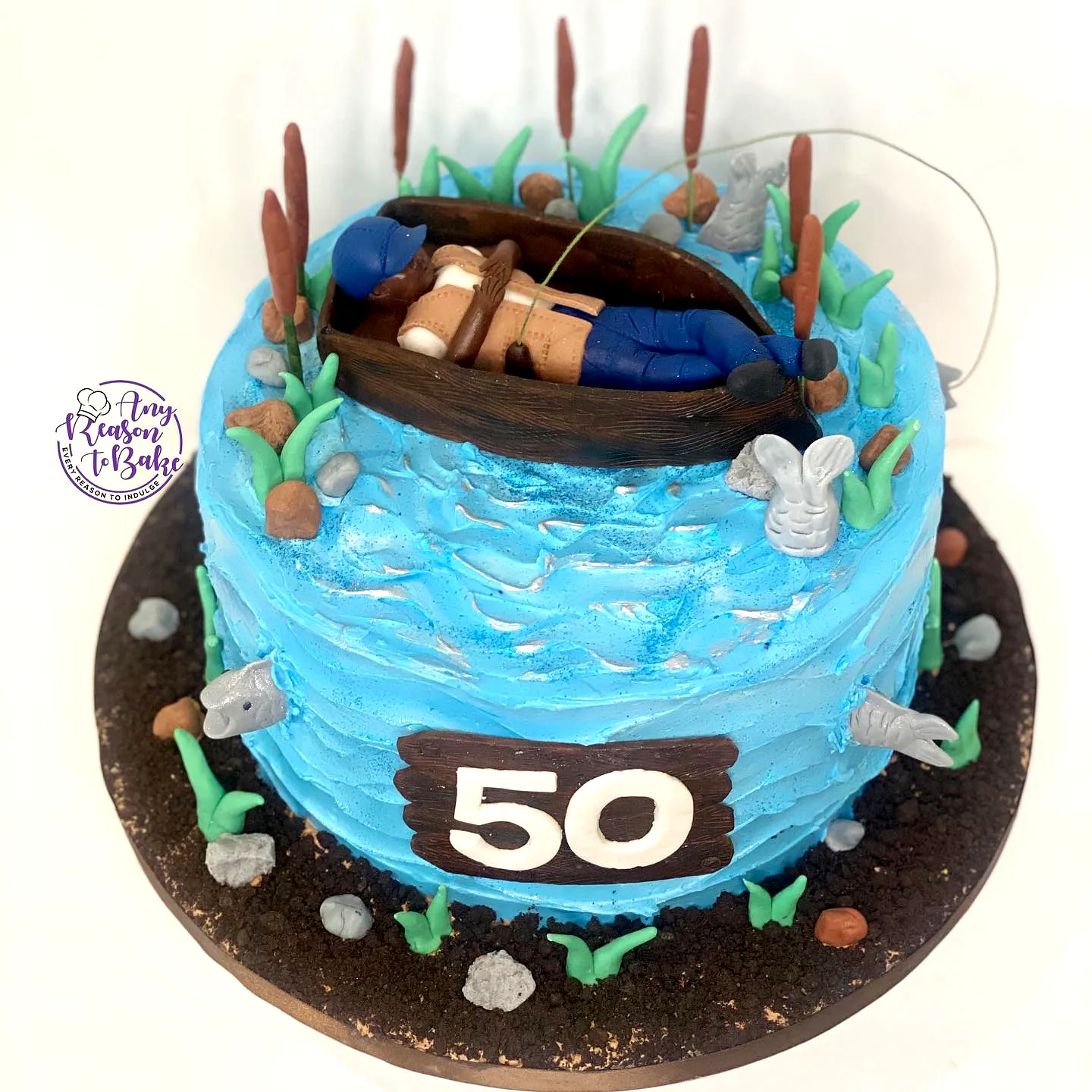 Whimsical Fishing Theme Birthday Cake for Adults with Vibrant Blue Frosting