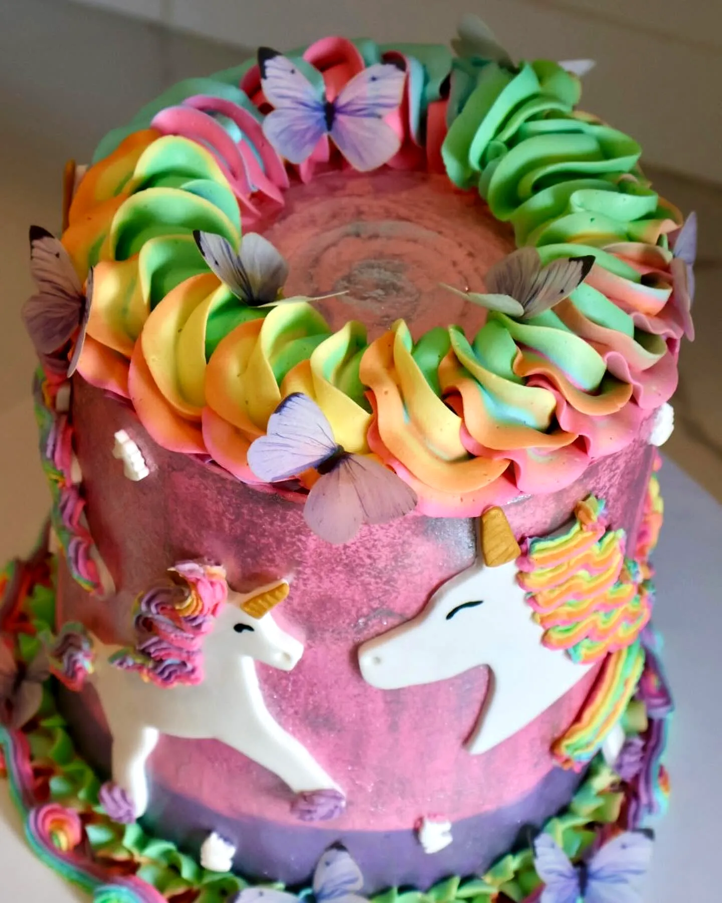Whimsical Unicorn Birthday Cake Design with Ombre Pastel Colors and Decorations