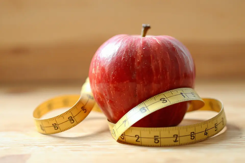 apple and measuring tape